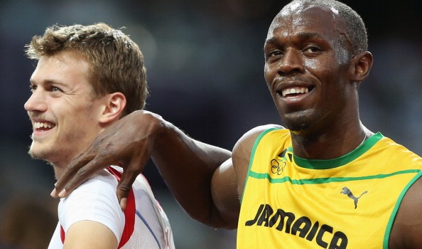 Il giamaicano Usain Bolt con il francese Christophe Lemaitre